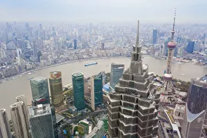 Futuristic Jinmao Tower overlooking the Huangpu river, Bund and Shanghai City, Shanghai Futuristic Jinmao Tower overlooking the Huangpu river, Bund and Shanghai City, Shanghai