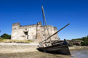 Gerezani an ancient fort with traditional dhow, Kilwa Kisiwani, coast of Tanzania Gerezani an ancient fort with traditional dhow, Kilwa Kisiwani, coast of Tanzania