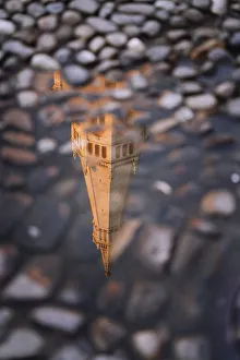 Ghirlandina tower reflecting on water in Piazza Grande, Modena, Emilia Romagna, Italy Ghirlandina tower reflecting on water in Piazza Grande, Modena, Emilia Romagna, Italy