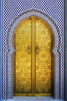 Gold and tile work of the royal palace door in Fes. Morocco Gold and tile work of the royal palace door in Fes. Morocco