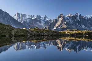 The group of Mont Blanc is reflected in Lake Cheserys. Chamonix. Haute Savoie. France The group of Mont Blanc is reflected in Lake Cheserys. Chamonix. Haute Savoie. France