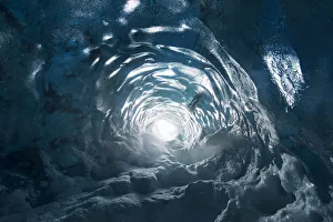 Hole inside an ice cave in the Vatnajokull National Park, Iceland Hole inside an ice cave in the Vatnajokull National Park, Iceland