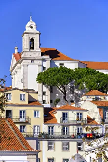 Houses and church in Alfama, a traditional district of Lisbon. Portugal Houses and church in Alfama, a traditional district of Lisbon. Portugal