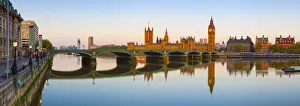 The Houses of Parliament & The River Thames illuminated at sunrise The Houses of Parliament & The River Thames illuminated at sunrise