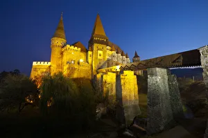 Prints of Hunyadi Castle or Corvins Castle illuminated at dusk, Hunedoara, Transylvania, Romania Romania Prints: Hunedoara Castle Print at Dusk, Transylvania, Romania