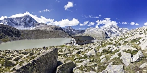 The Hut Garibaldi by the Lake Venerocolo and the north wall of Mount Adamello The Hut Garibaldi by the Lake Venerocolo and the north wall of Mount Adamello