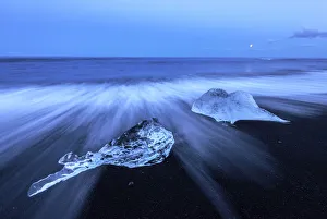 Icebergs stranded on the Breidamerkursandur beach in the Vatnajokull National Park at Icebergs stranded on the Breidamerkursandur beach in the Vatnajokull National Park at