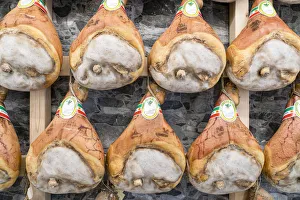 Italy traditional ham (prosciutto) Parma hanging in maturation room Italy traditional ham (prosciutto) Parma hanging in maturation room
