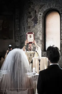 Italy, Umbria, catholic priest during the wedding liturgy Italy, Umbria, catholic priest during the wedding liturgy