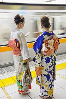 Japan, Tokyo, Girls in Kimono on Subway Platform Japan, Tokyo, Girls in Kimono on Subway Platform
