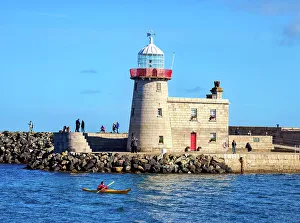 Irish Coastline Images Prints: Kayaker in front of the Howth Lighthouse, Howth, County Dublin, Ireland