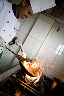 Kigali, Rwanda. A chef prepares lunch at the Bourbon Coffee shop. (MR) Kigali, Rwanda. A chef prepares lunch at the Bourbon Coffee shop. (MR)