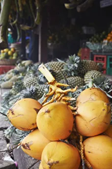 King coconuts at fruit stall in market, Galle, Sri Lanka King coconuts at fruit stall in market, Galle, Sri Lanka