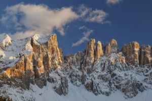 The Latemar spiers at sunset from Carezza lake, Trentino Alto-Adige, Italy The Latemar spiers at sunset from Carezza lake, Trentino Alto-Adige, Italy