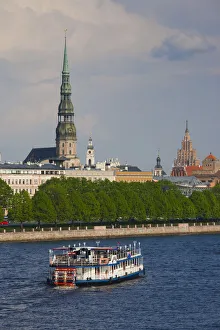 Latvia, Riga, Daugava River tourist boat and Riga skyline Latvia, Riga, Daugava River tourist boat and Riga skyline