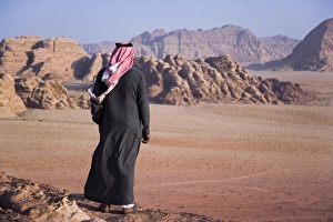 A local bedouin man looks out over Wadi Rum, Jordan (MR) A local bedouin man looks out over Wadi Rum, Jordan (MR)