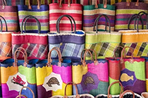 Madagascar, The coloured hand made straw bags typical of Madagascar Madagascar, The coloured hand made straw bags typical of Madagascar