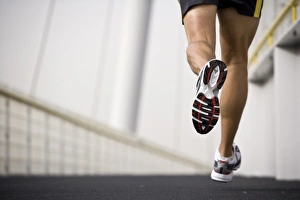A Man Running Across a Bridge Print