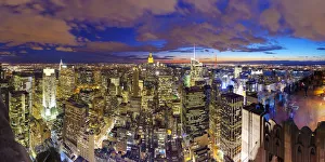 Manhattan view towards Empire State Building at sunset from Top of the Rock, at Rockefeller Manhattan view towards Empire State Building at sunset from Top of the Rock, at Rockefeller