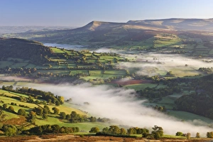 Mist covered rolling countryside backed by the Black Mountains Mist covered rolling countryside backed by the Black Mountains