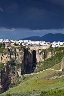 Moody storm clouds & contrasty light over Puento Nuevo & the White Village of Ronda Moody storm clouds & contrasty light over Puento Nuevo & the White Village of Ronda