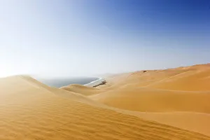 Namib desert meets the ocean, Sandwich Harbour, Swakopmund, Namibia, Africa Namib desert meets the ocean, Sandwich Harbour, Swakopmund, Namibia, Africa