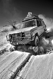 Prints of Namibia, Damaraland. The desert environment and lack of paved roads in many the interior region means that the most travel is by four wheel drive vechicles Namibia Prints: Namibia, Damaraland Print: A Four-Wheel Drive Landscape