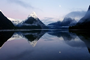 New Zealand, Nuova Zelanda, Fiordland, Milford Sound and moon during a cold and misty New Zealand, Nuova Zelanda, Fiordland, Milford Sound and moon during a cold and misty
