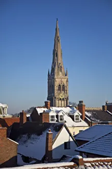 Newark, UK. The Church of St Mary Magdalene rises above Newarks eclectic roofscape Newark, UK. The Church of St Mary Magdalene rises above Newarks eclectic roofscape