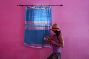 North Africa, Morocco, Meknes district. Girl reading a book by a window North Africa, Morocco, Meknes district. Girl reading a book by a window