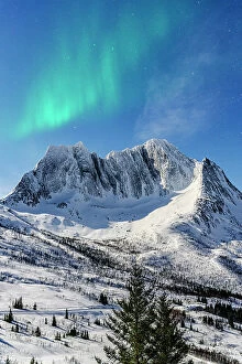 Q3 2023 Collection: Northern Lights over Breidtinden mountain peak covered with snow, Mefjorden, Senja, Troms county