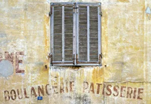 Old shutters and weathered Boulangerie-Patisserie bakery sign, Cassis, Bouches-du-RhAA´ne Old shutters and weathered Boulangerie-Patisserie bakery sign, Cassis, Bouches-du-RhAA´ne