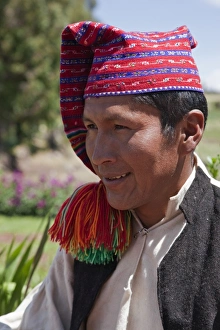 Peru, A Quechua-speaking man on Taquile Island wearing traditional dress Peru, A Quechua-speaking man on Taquile Island wearing traditional dress