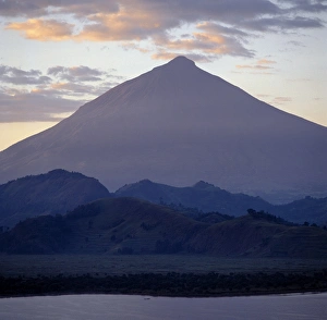 Photographed from Lake Mutanda at sunrise, Mount Muhavura looms like a huge pyramid Photographed from Lake Mutanda at sunrise, Mount Muhavura looms like a huge pyramid