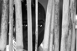 Portrait of a boy behind the fence. Malawi, Africa Portrait of a boy behind the fence. Malawi, Africa