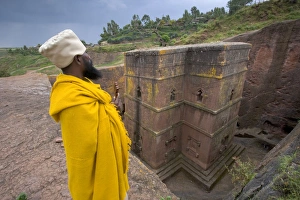 Priest outside the Sunken Rock Hewn church of Bet Giyorgis Priest outside the Sunken Rock Hewn church of Bet Giyorgis
