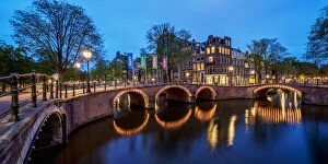 The Netherlands Collection: Prinsengracht and Reguliersgracht Canals and Bridges at twilight, Amsterdam, North Holland