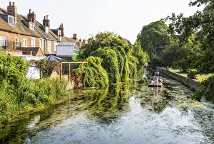 Punting on the River Stour, Canterbury, Kent, England Punting on the River Stour, Canterbury, Kent, England