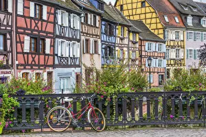 Images Dated 16th October 2014: Red Bike & Timbered Buildings, Colmer, Alsace, France