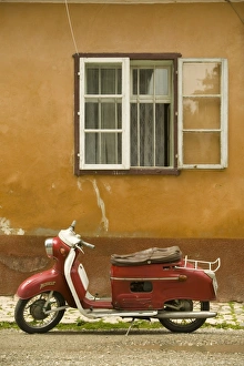Red moped, Sighisoara, Transylvania, Romania Red moped, Sighisoara, Transylvania, Romania