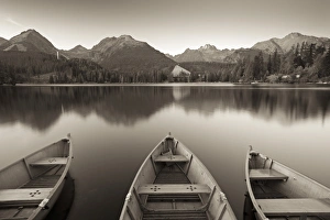 Rowing boats and mountains beneath a twilight sky, Strbske Pleso Lake in the High Tatras Rowing boats and mountains beneath a twilight sky, Strbske Pleso Lake in the High Tatras