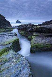 Rushing stream through eroded slate ledges, Trebarwith Strand, Cornwall, England Rushing stream through eroded slate ledges, Trebarwith Strand, Cornwall, England