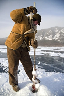 Russia, Siberia, Baikal; Undergoing preparations for fishing on frozen lake baikal in Russia, Siberia, Baikal; Undergoing preparations for fishing on frozen lake baikal in