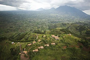 Rwanda. The luxurious Virunga Safari Lodge sits below looming volcanoes Rwanda. The luxurious Virunga Safari Lodge sits below looming volcanoes