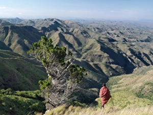 A Samburu warrior looks out over a vast expanse of A Samburu warrior looks out over a vast expanse of