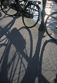 Prints of Shadow of Bikes, Amsterdam, Holland Images Dated 2001: Amsterdam Print: Shadow of Bikes