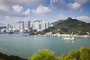 Ship passing stilt village of Lei Yue Mun on Lei Yue Mun Channel, Kowloon, Hong Kong Ship passing stilt village of Lei Yue Mun on Lei Yue Mun Channel, Kowloon, Hong Kong