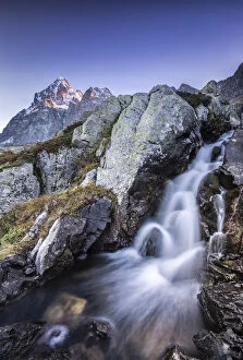 Images Dated 3rd September 2015: Small waterfall at the foot of Mount Monviso illuminated by the first light of dawn