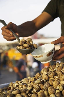 Snails for sale at one of the many food stalls that Snails for sale at one of the many food stalls that