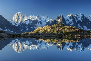 Snowy peaks of Dent Du Geant and Grandes Jorasses are reflected in Lac Blanc, Haute Savoie Snowy peaks of Dent Du Geant and Grandes Jorasses are reflected in Lac Blanc, Haute Savoie